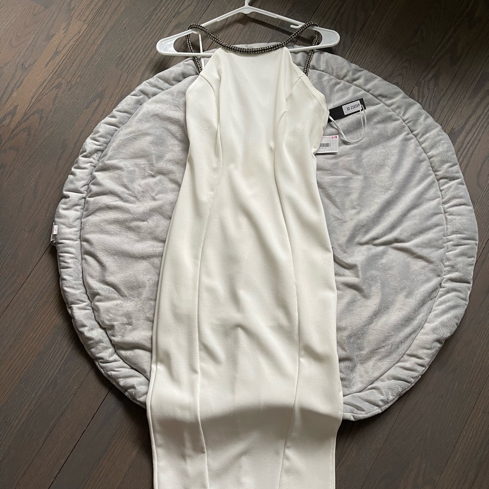 White fitted mid dress. Sexy back with rhinestone neckline and trim
